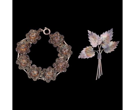 A vintage Serling standard white metal filigree vine leaf brooch together with a filigree blossom bracelet