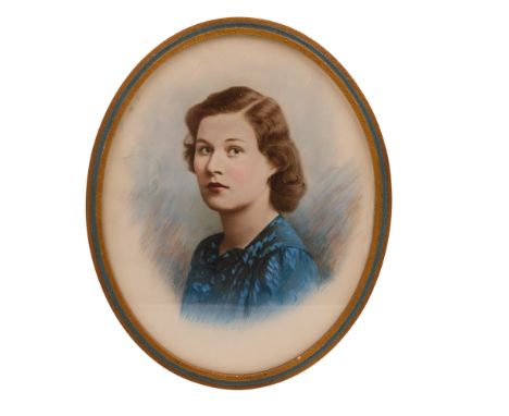 A subdued portrait of a woman wearing a blue floral dress, circa 1940s, watercolour overpainted photographic print, signed "S