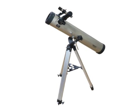 A Tasco 76 mm astronomical reflector telescope on an altazimuth mount and tripod with interchangeable lenses and accessories