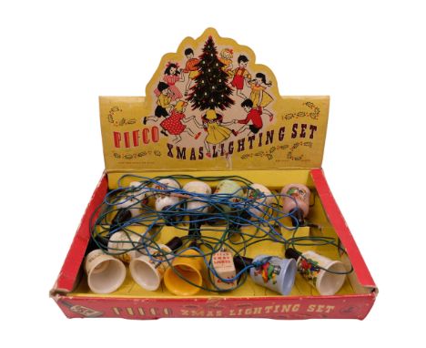 A box of vintage Pifco Christmas lights with a spare bulb