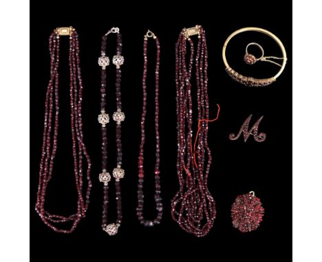 A group of antique and vintage German and other garnet jewellery including a hinged bangle, an initial "M" and one other broo