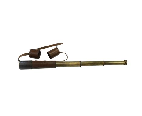 An early 20th Century three-draw brass spotting telescope by J H Steward Ltd of London, being "The 22/100 Spotter", having 48