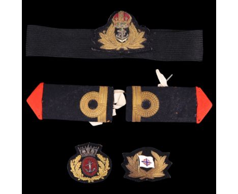 Royal Navy and Merchant Navy officers' cap badges together with a pair of epaulettes 