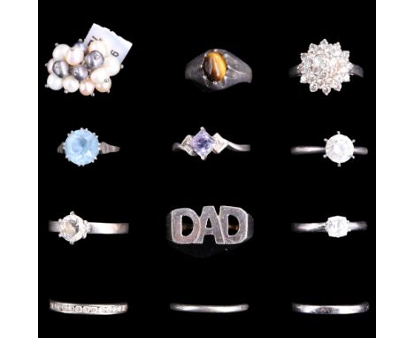 A group of vintage to contemporary white metal finger rings variously set with blue topaz, banded-agate and pearls, etc, 47 g