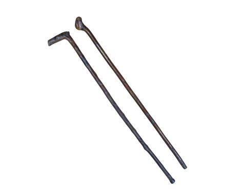 Two vintage rustic wooden walking sticks, longest 85cm