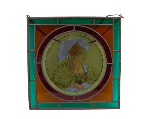 A late 19th / early 20th Century stained glass panel, centred by a portrait of a Renaissance woman, 39 cm
