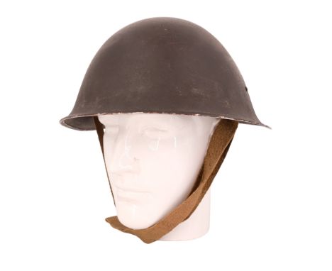 A British Army Mk III steel helmet, its liner dated 1944