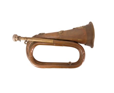 A copper bugle bearing Lincolnshire Regiment insignia