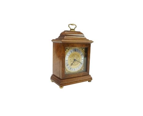 A Garrard walnut mantle clock, modelled in the form of a Georgian bracket clock, height 24 cm