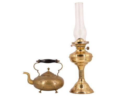 A vintage brass oil lamp together with a Victorian brass kettle having a turned and ebonised handle, former height to burner 
