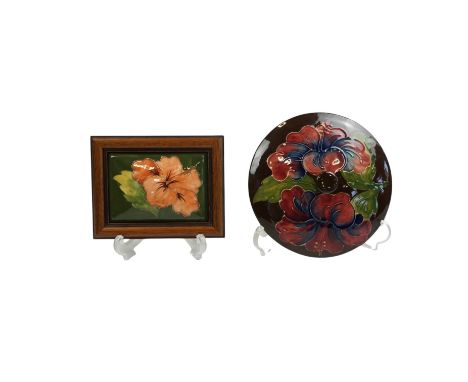 Two Moorcroft ceramic lids, largest 17cm diameter