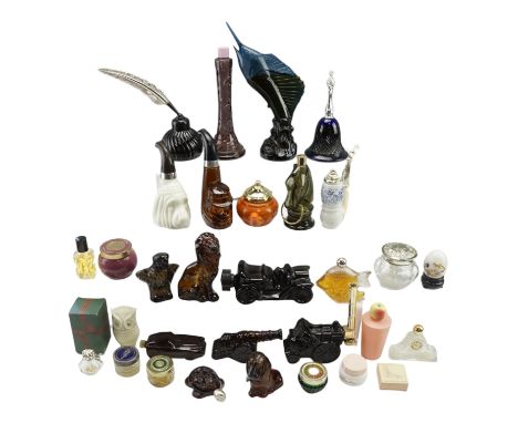 A large group of vintage Avon novelty glass perfume bottles, together with similar Avon cosmetics