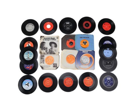 A small group of 45 RPM single records including Slade, The Rolling Stones, T-Rex and The Sweet
