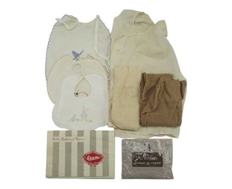 A small group of vintage costume and clothing including "Aristoc" and "Estam" stockings in original packaging, babies' bibs, 