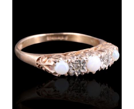 A 1950s opal and diamond ring, comprising three graded opal cabochons divided by small illusion-set diamond brilliants on 9 c