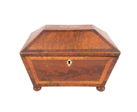 A George III mahogany and burr-wood veneered tea caddy, marquetry-inlaid, string-inlaid and cross-banded, of pronounced sarco