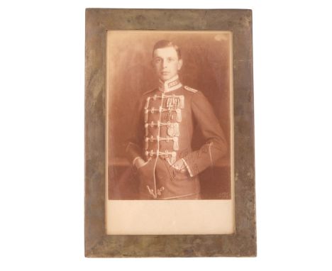 A 1919 signed studio photographic portrait of a Fliegertruppen pilot, in electroplate frame, 33 cm x 23 cm overall