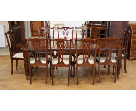 A Victorian walnut extending dining table together with nine (five plus four) old reproduction Chippendale style mahogany cha