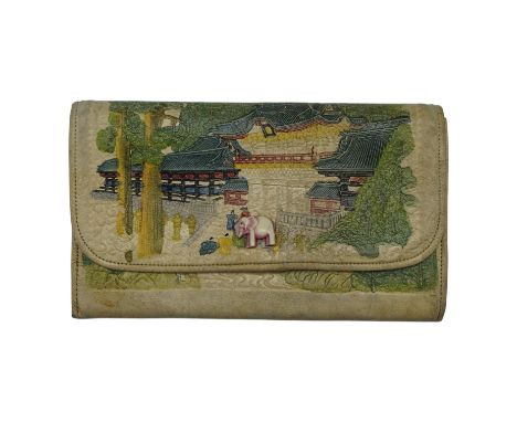 A vintage Japanese "Take Uchi Tōyō Taiheiki" painted leather clutch bag, having an elephant-form button and internal mirror, 