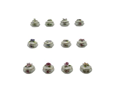 A set of Royal Albert "Flowers of the Month" ceramic trinket boxes