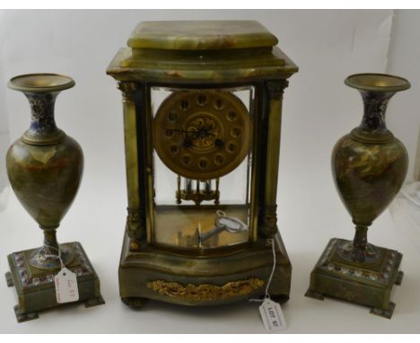 A late 19th century French clock garniture set, in green onyx, with Champlev&eacute; enamel, the clock with an 8-day movement