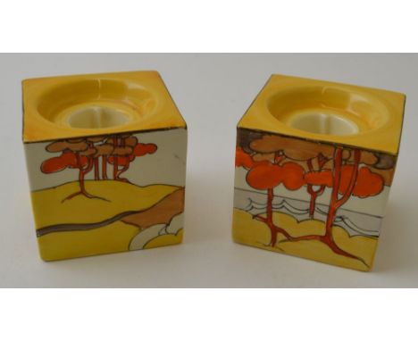 A pair of Clarice Cliff Coral Firs pattern hand painted pottery cube form candle holders, pattern number 658, bear Clarice Cl