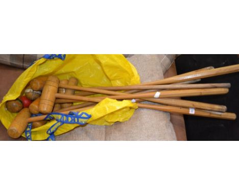 Wooden croquet mallets and balls