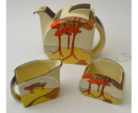 A Clarice Cliff Coral Firs pattern three piece pottery tea set, classic Art Deco design from the 1930's, comprising teapot, m