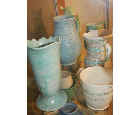 A collection of six 1920s / 50s pottery jugs, including examples by Wade Heath, Carltonware, and Wood's Burslem.