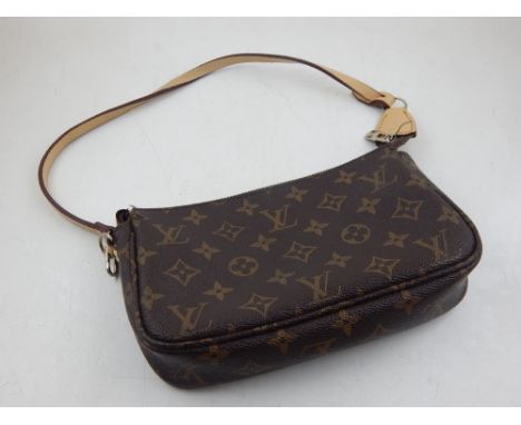 A Louis Vuitton monogram canvas clutch bag