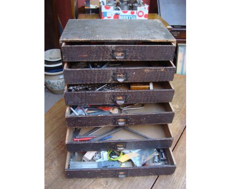 Guages/tools in a small cabinet. 