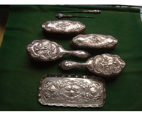 A silver backed dressing table set with silver tray and button hooks. 