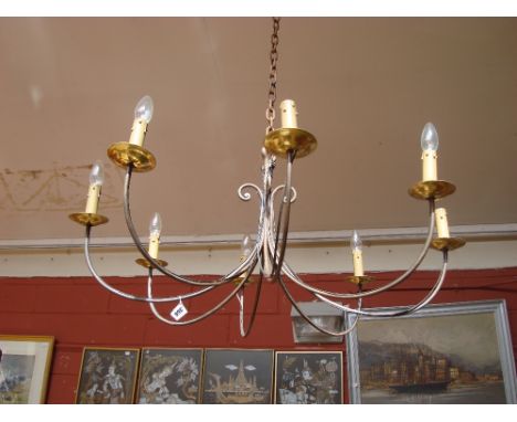 A French wrought iron eight branch chandelier. 