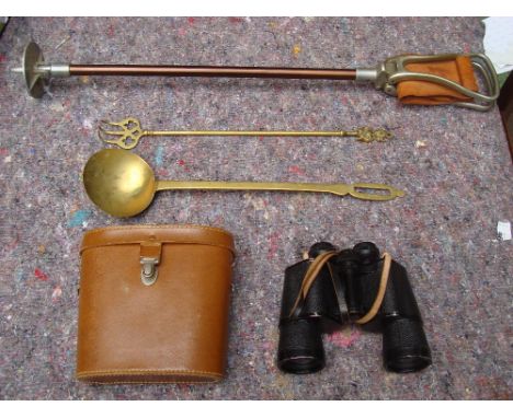 A shooting stick, binoculars, a toasting fork and a chestnut roaster. 