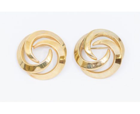 A pair of 9ct gold matching brooches, comprising hollow circular form with entwined crescents, diameter approx 30mm, pin and 