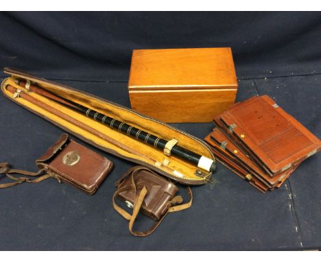 A collection of assorted photographs in wooden box together with two cameras in leather cases, five wooden plates for a vinta