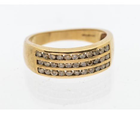 A diamond and 9ct gold dress ring, comprising three rows of channel set round brilliant cut cinnamon diamonds,  total diamond