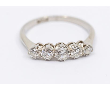 A five stone diamond and platinum ring, comprising a row of claw set graduated old cut diamonds, total diamond weight approx 