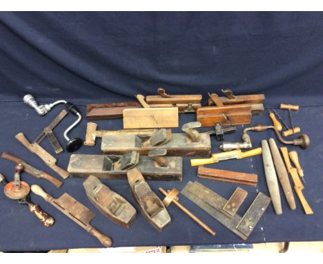 A collection of wooden vintage tools to include plains, gauges, squares and more.