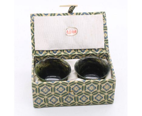 A cased pair of spinach jade tea bowls, fluted design, each height  approx 30 x diameter approx 50mm, combined total gross we