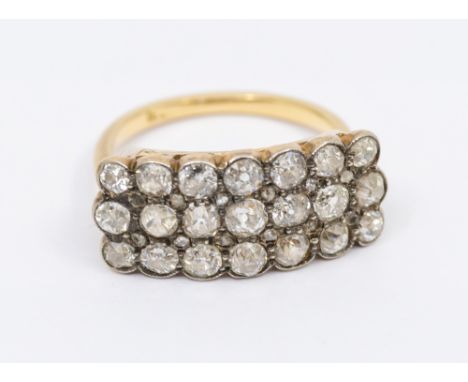 A diamond and 18ct gold cluster ring, comprising a rectangular three row mount set with old European cut diamonds with small 