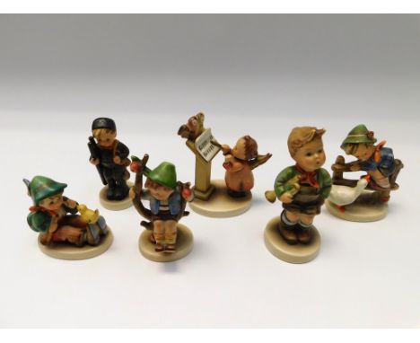 Goebel/MJ Hummel - A collection of six figurines to include "Singing Lesson" and others (no titles) including a young boy wit