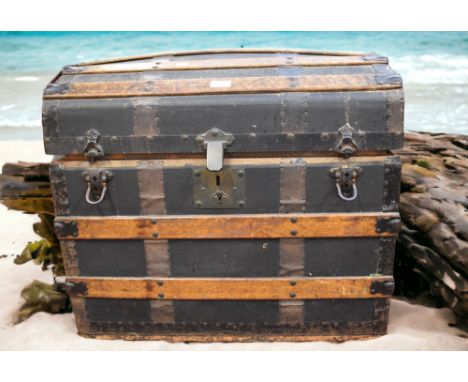 A late Victorian/early Edwardian Wright Brothers of Richmond, dome topped trunk with internal compartments.
