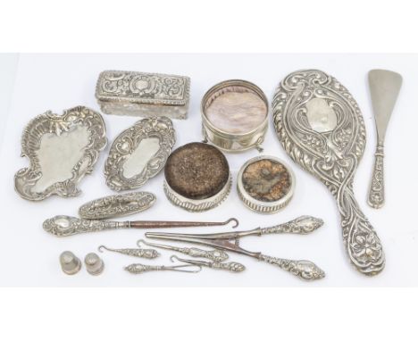 A collection of silver items to include; a Victorian silver cased fabric circular pin cushion, hallmarked by Hamilton & inche