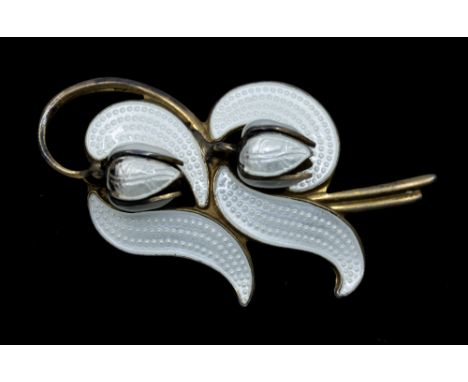 Norwegian interest: a Modernist enamel silver gilt 'Lily of the valley' brooch by Askel Holmsen comprising white guilloche en