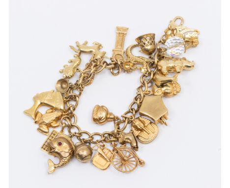 A 9ct gold charm bracelet comprising uniform links, the clasp marked 375, length approx 17cm, suspending various 9ct gold and