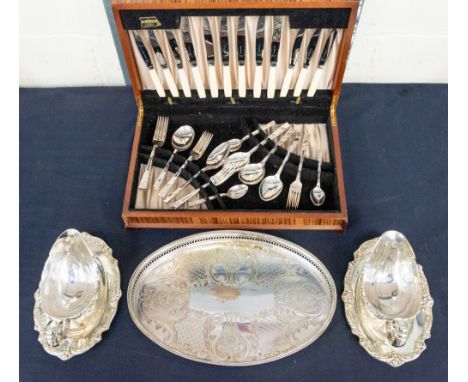 A 1960s canteen of cutlery serving tray and two heavy silver plate gravy/sauce boats with stands&nbsp;