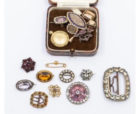 A collection of Georgian and later mourning brooches to include a Georgian marquise shaped gold brooch, with glazed plaited h