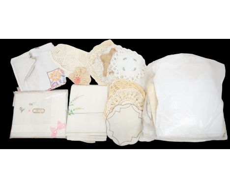 A collection of textiles to include: embroidered cloths, tray cloths, doilies, lace tablecloths, napkins, coloured and embroi