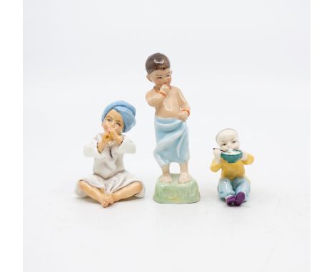A collection of three Royal Worcester figures
